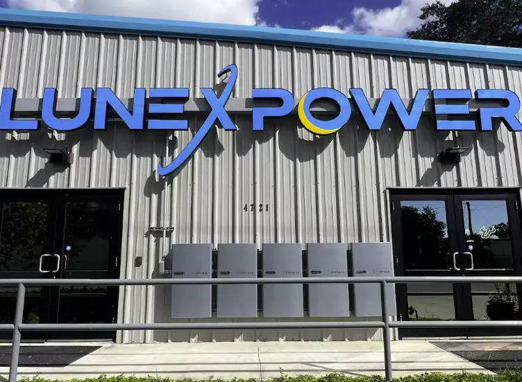 Front exterior of the Lunex Power Tampa headquarters with company signage and battery systems displayed