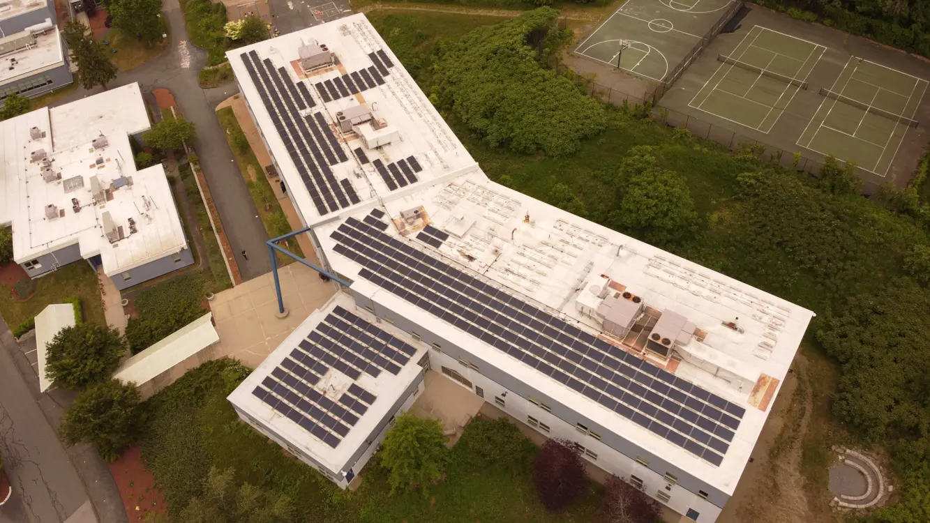 Lunex ballasted commercial rooftop solar installation at Bancroft School in Worcester, Massachusetts.