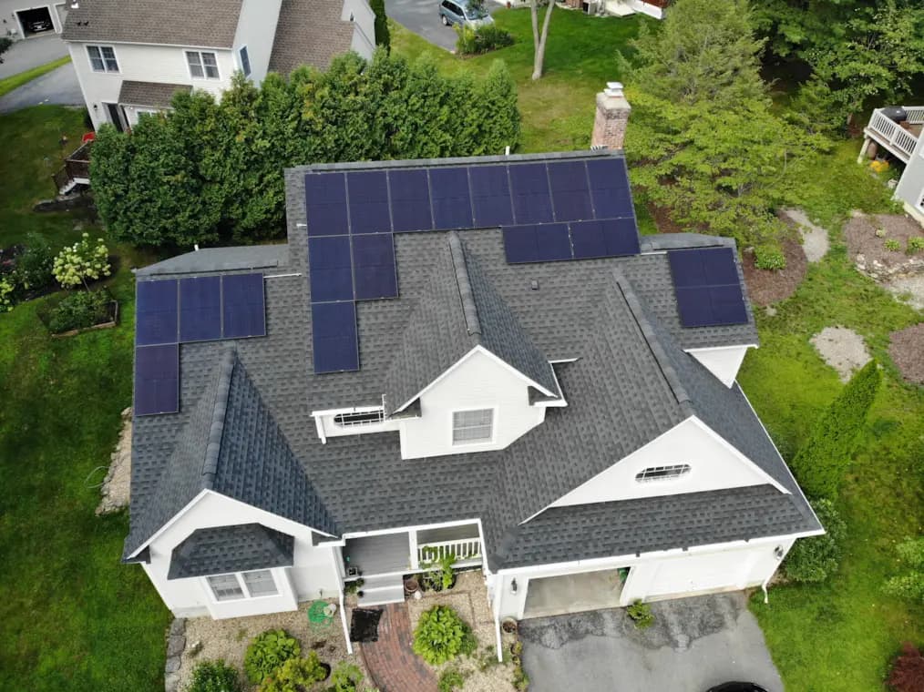 Lunex residential solar installation on a coastal New England home with a multi-slope roof.