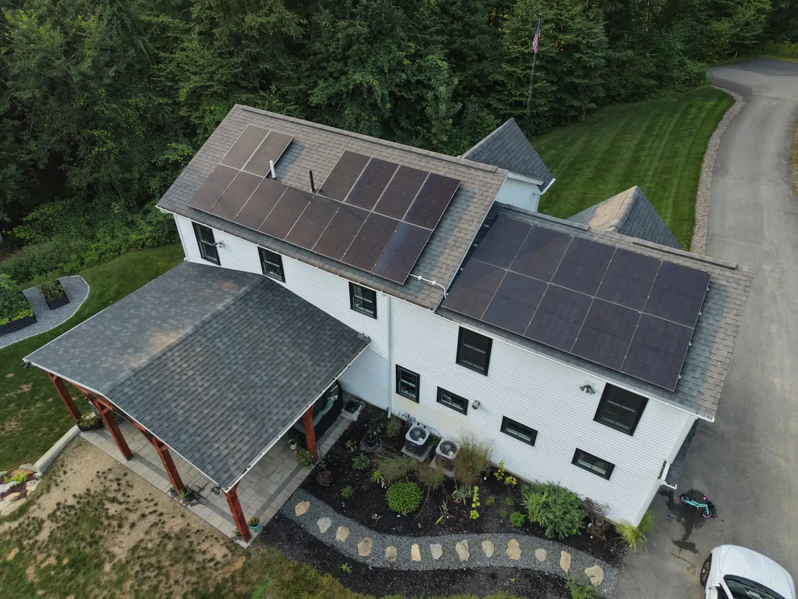 Aerial view of a residential rooftop solar panel installation by Lunex Power in Massachusetts